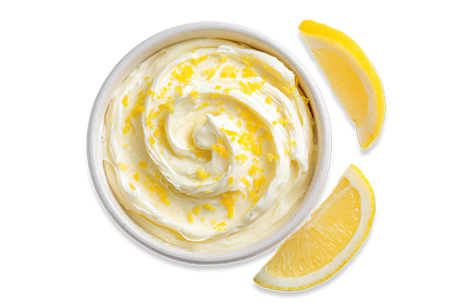 Butter mit Zitronenschalen, daneben Zitronenspalten